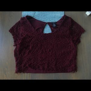 A maroon lacy shirt